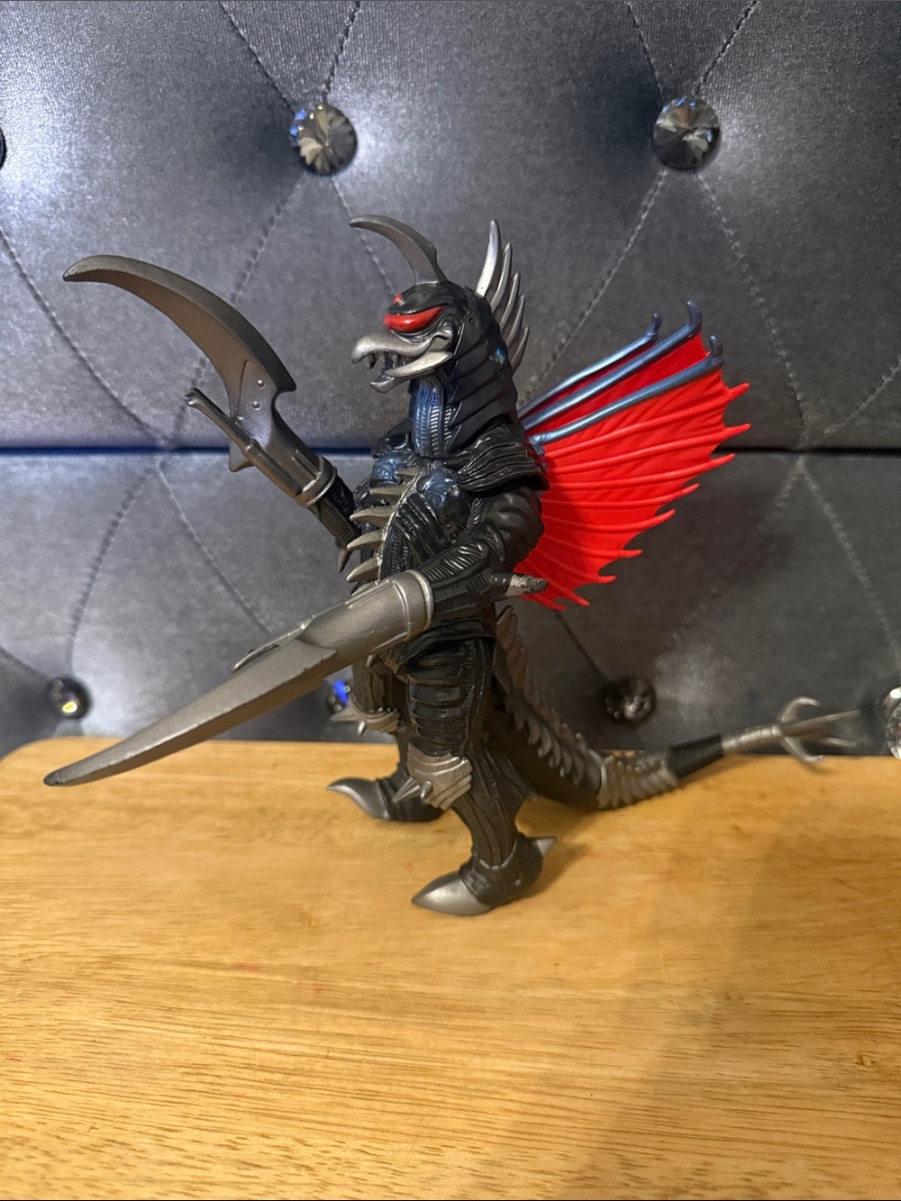 Articulated Black Monster Figure with Red Wings